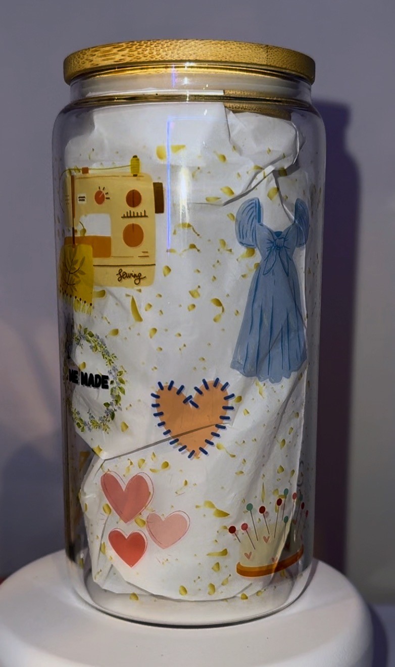 Clear glass tumber with sewing theme